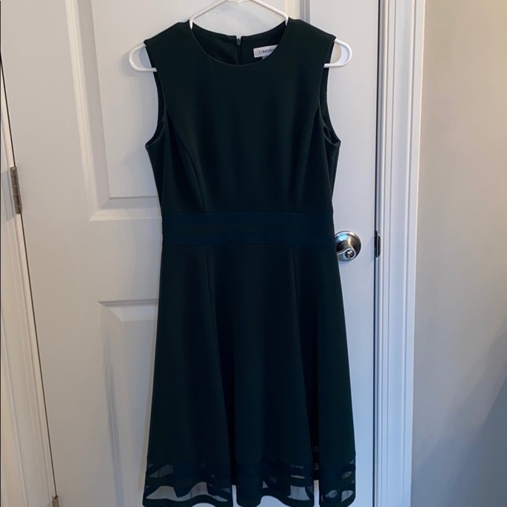 A once worn Calvin Klein dark green dress.
